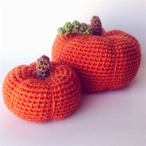 Crochet your own pumpkin family with this easy-to-follow pattern! Each handmade pumpkin takes only 3 hours and requires $4 in materials. Choose a warm shade of orange yarn for the body, light brown for the stem, and green for the vines, plus polyfill and two different-sized hooks (J/10-6.00mm and L/11-8.00mm). 